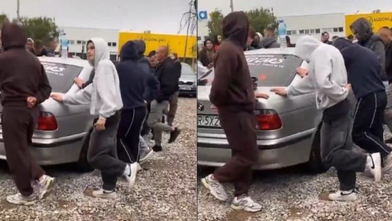 Właściciel komisu zrobił konkurs. Trzeba stać na jednej nodze i trzymać BMW które jest do wygrania Zdjęcie wpisu